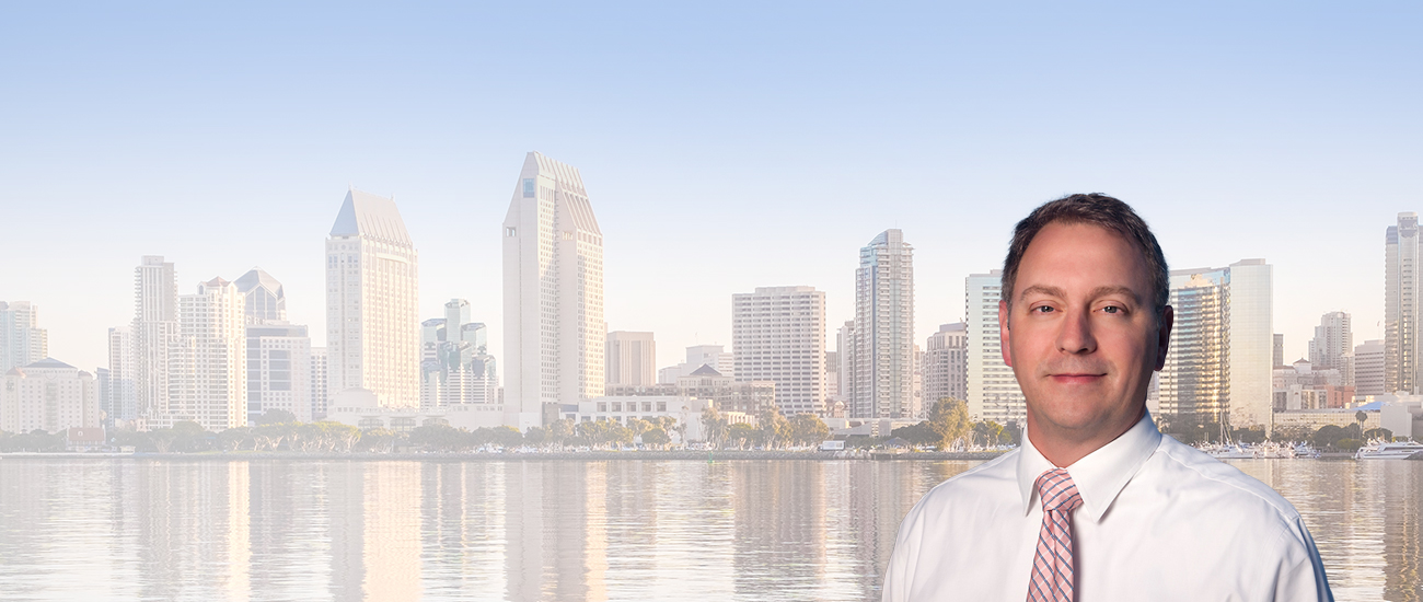 Joshua R. Bourne with the San Diego skyline in the background.