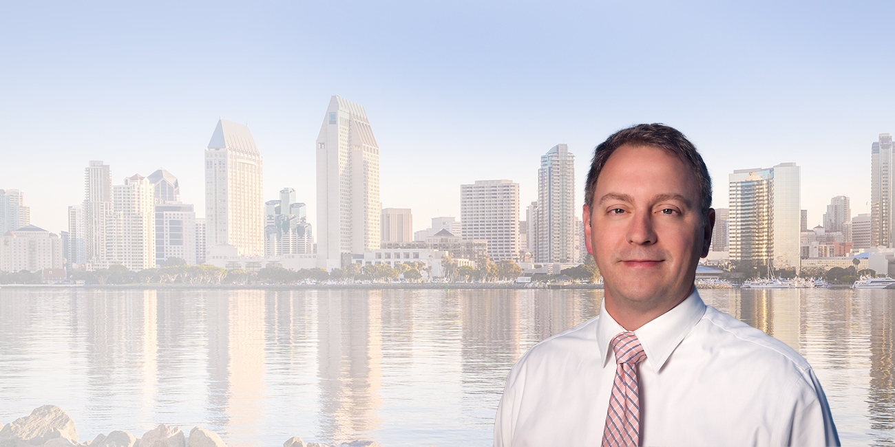 Joshua R. Bourne with the San Diego skyline in the background.